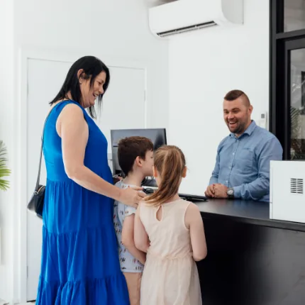 People standing at the counter of European car service
