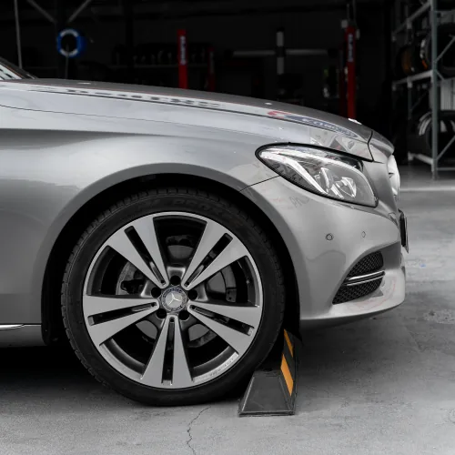 Silver Mercedes-Benz wheel and tyre at European car service workshop in Brisbane