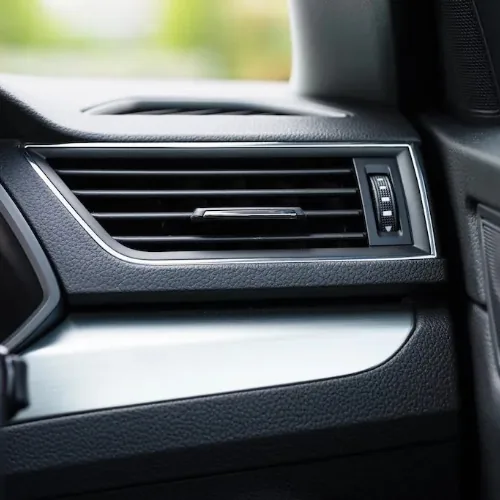 European car air conditioning vent and controls in luxury vehicle interior