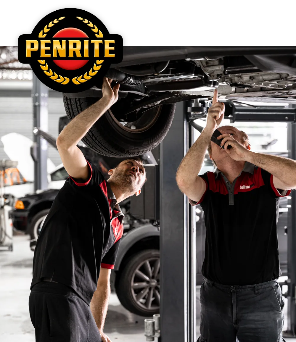Professional mechanics performing European car oil change service at Brisbane workshop