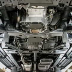 Underside view of European car during professional inspection at Brisbane workshop