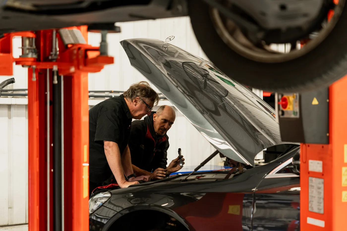 Bosch Service Brisbane technicians servicing the air conditioning system of a European car